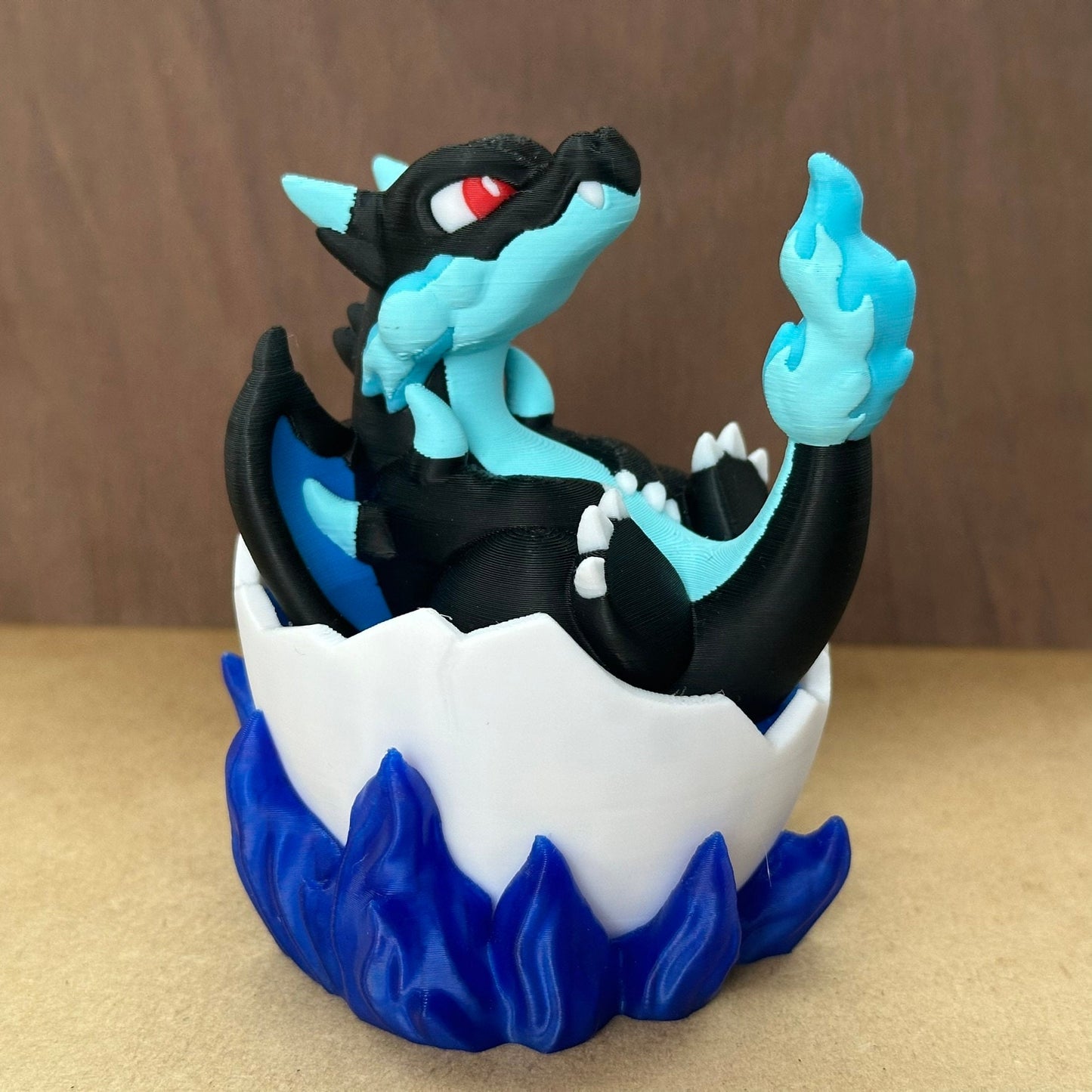 Figurine Pokemon Mega Dracofeu dans son oeuf