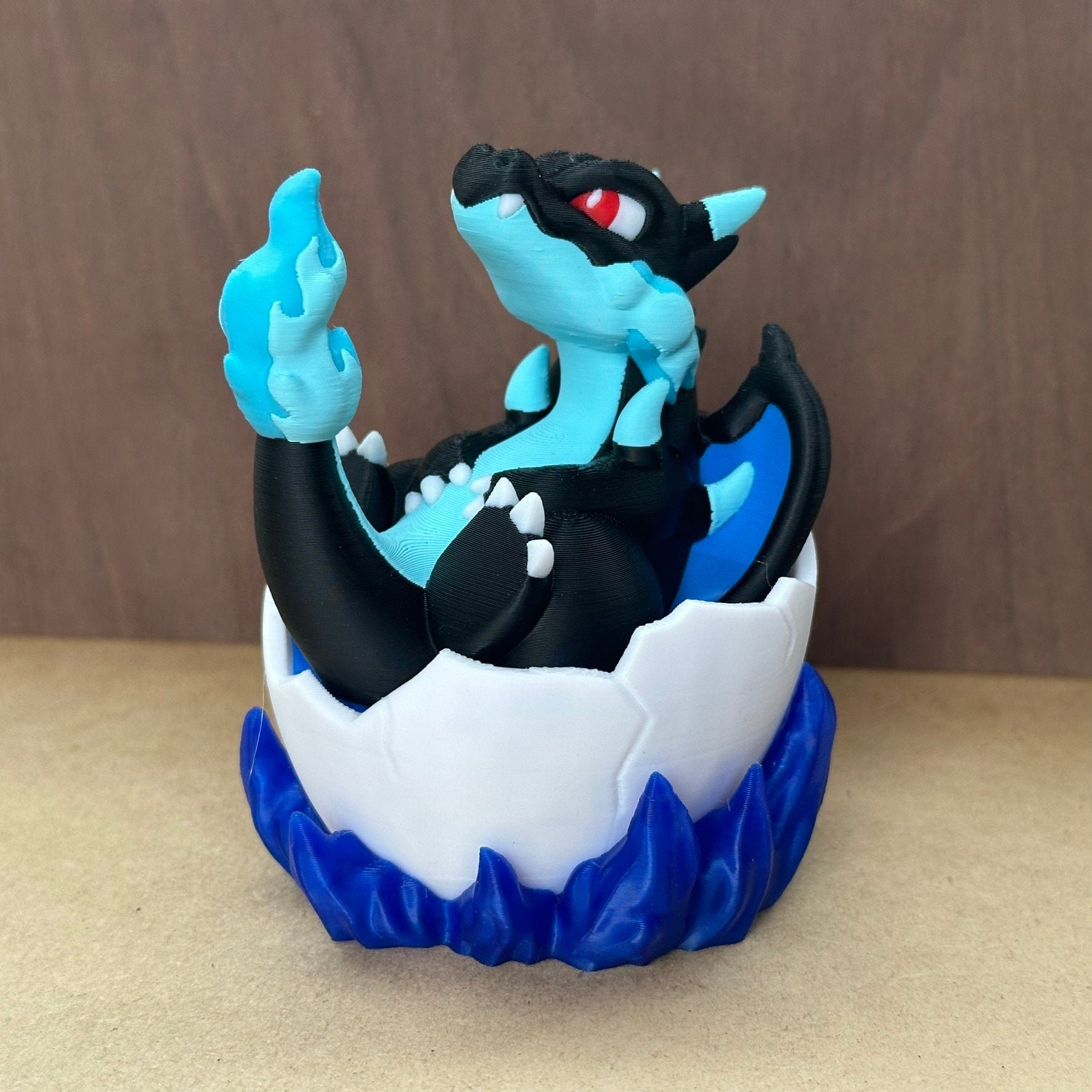 Pokemon Mega Charizard figure in its egg